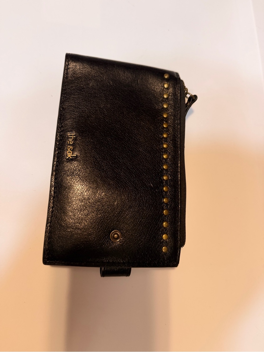The Sak Black Leather Wallet with Brass Studs